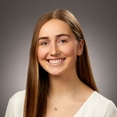 headshot of graduate olivia guy