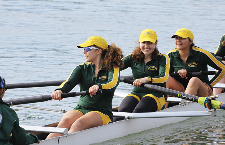 Three Upper School students in a rowing boat