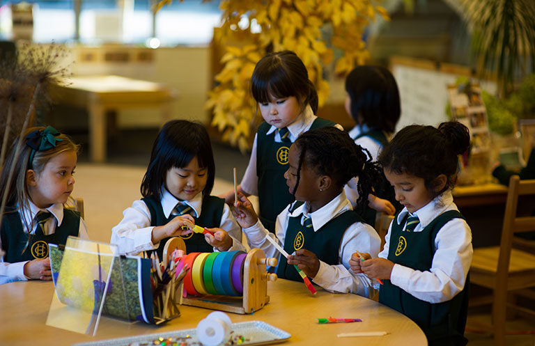 Junior School Students play together at a table