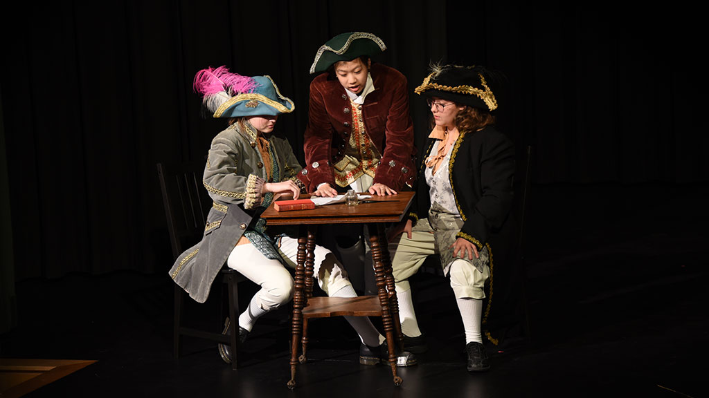 Three students dressed as pirates act in the Middle School play.