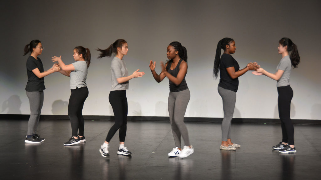 Six students perform at a dance show.