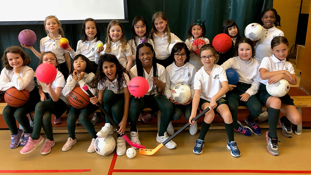Team photo of the Multisport Squad with their different sports equipment