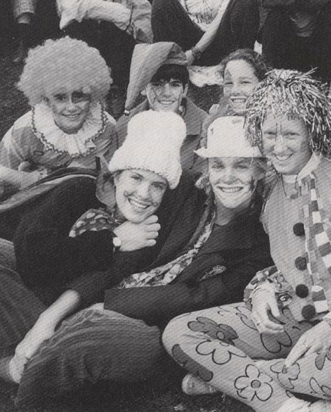Students dressed in spirit wear pose together in a group.