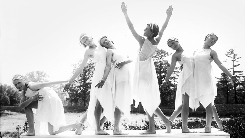 Black and white photo of an outdoor student drama performance.