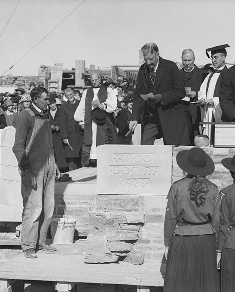 Black and white photo of officials laying the cornerstone of Havergal's Upper School building in 1926 as a crowd looks on.