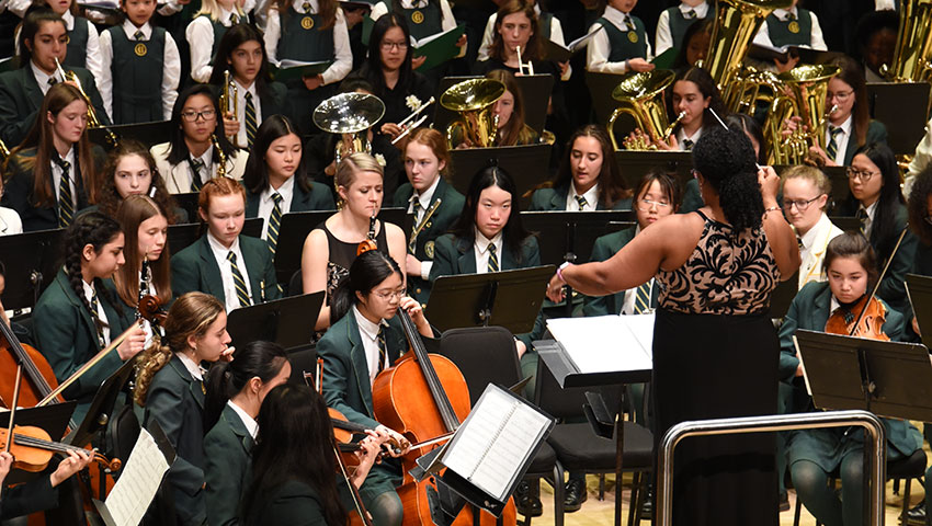 Students in a band perform at Roy Thomson Hall.