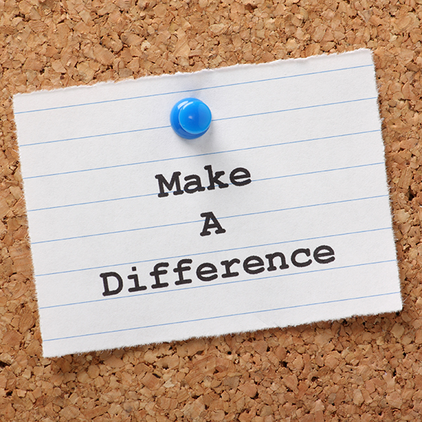 note pinned to a cork board that says "Make a Difference"