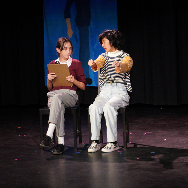 Middle School actors performing on stage