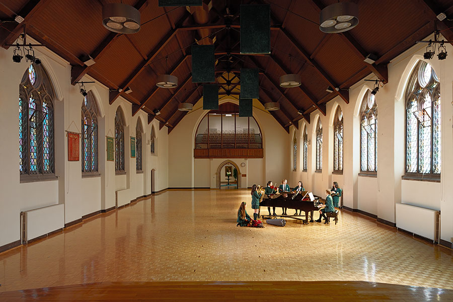 A group of student musicians perform in the Brenda Robson Hall.