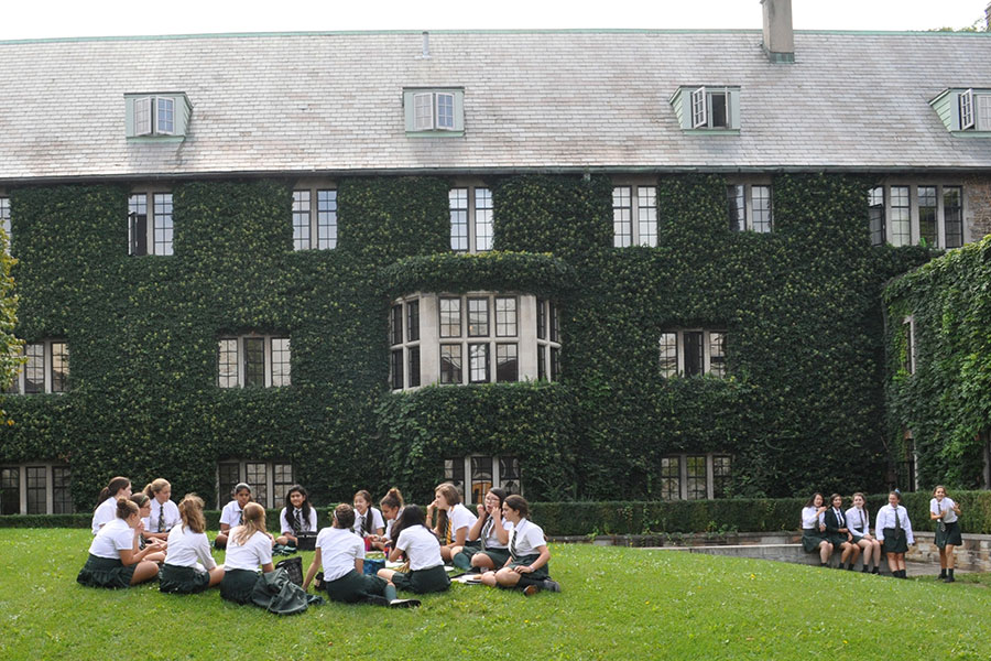 Students gather in groups in the North Quad.
