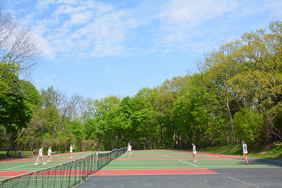 Students playing tennis.