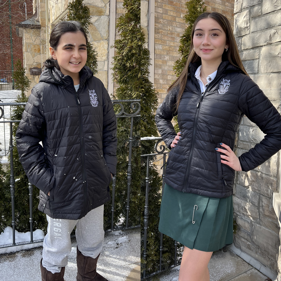 Students posing with Havergal puffy jackets. 