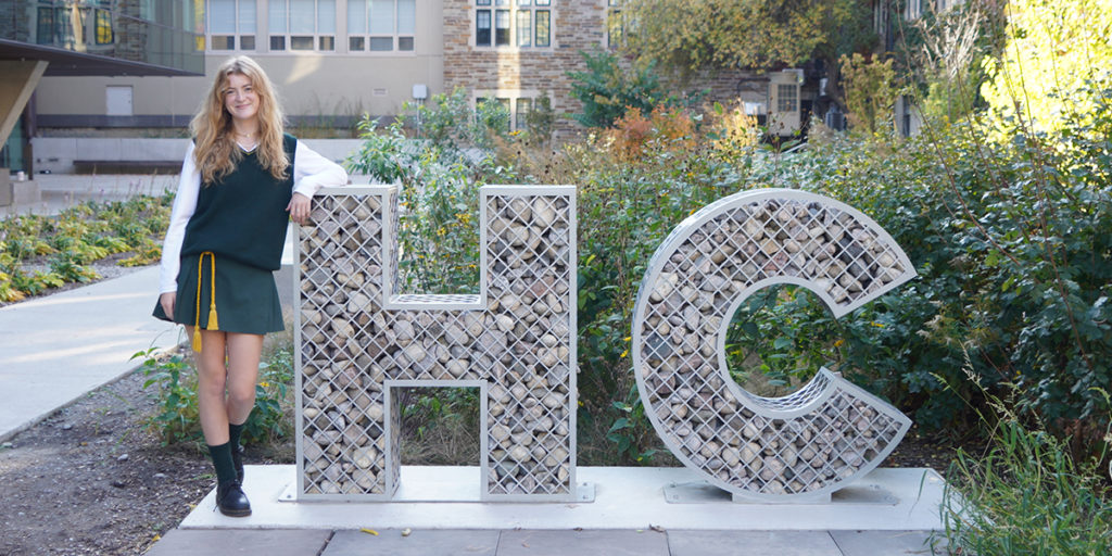 Maddy posing with the HC sign