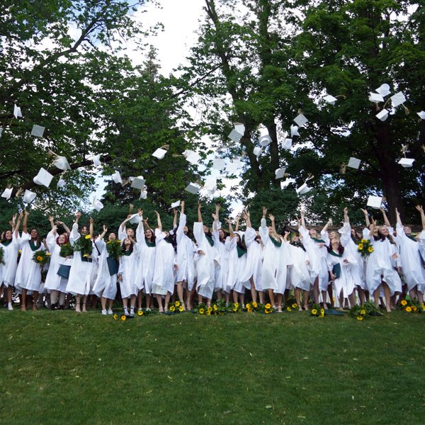 Grads throwing up their caps at Graduation 2022.