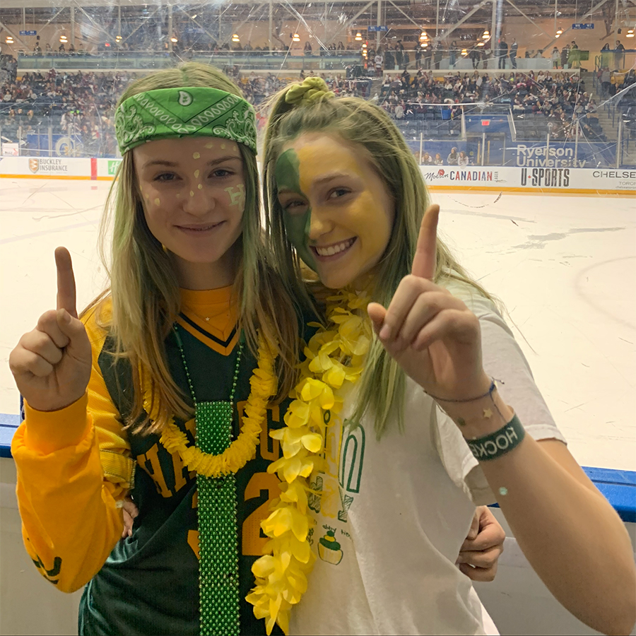 Kate Newton at Hockey Day with a friend.