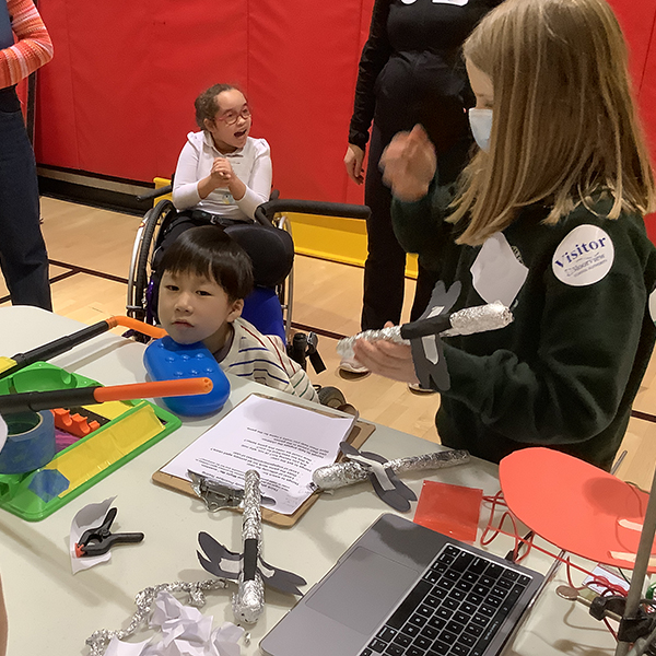 A Holland-Bloorview student using one of the Havergal midway games.