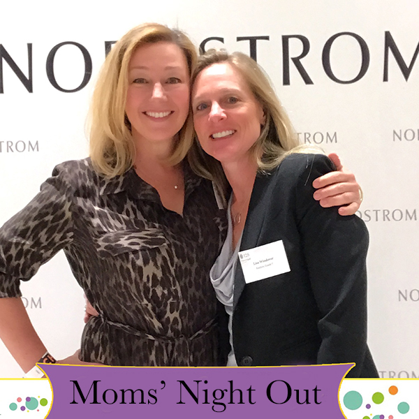 Two guests posing at a previous Moms' Night Out event.