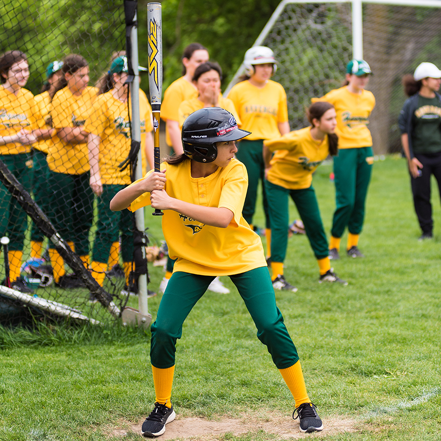 Softball player at bat.