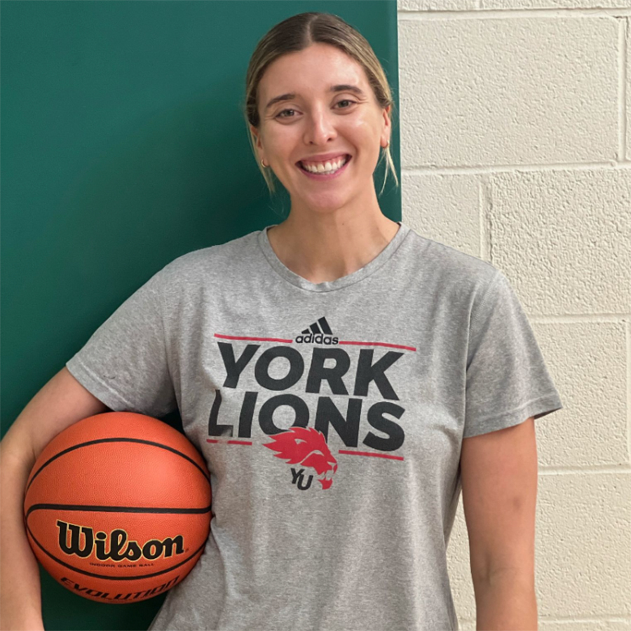 Photo of Mrs. Shotbolt holding a basketball.