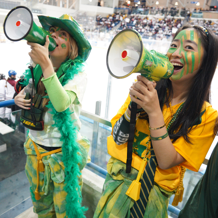 Nicole with a friend at Hockey Day, cheering on the crowd.