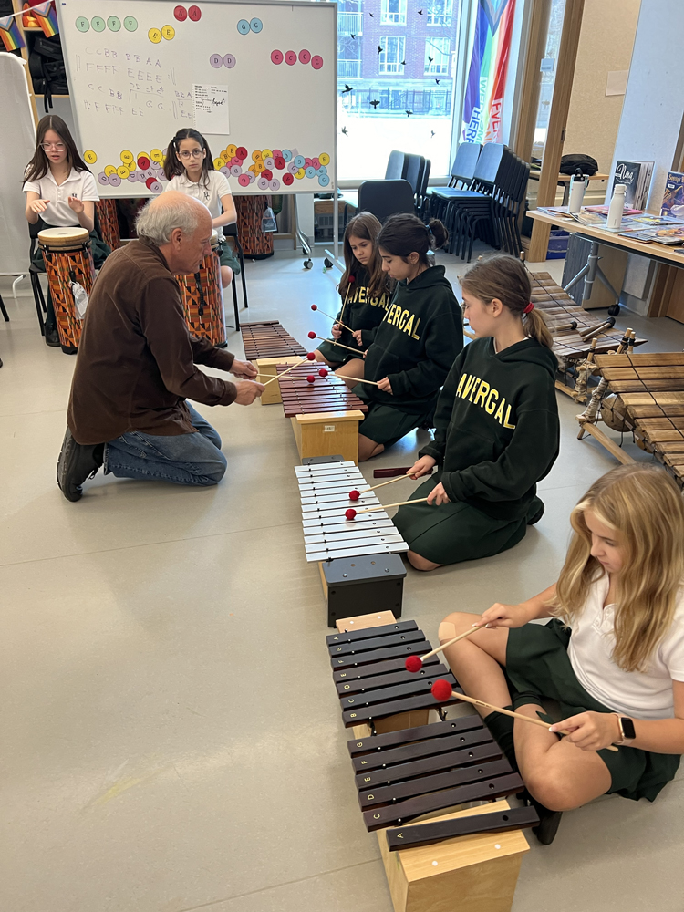 Doug Goodkin teaching kids how to play Orff instruments.