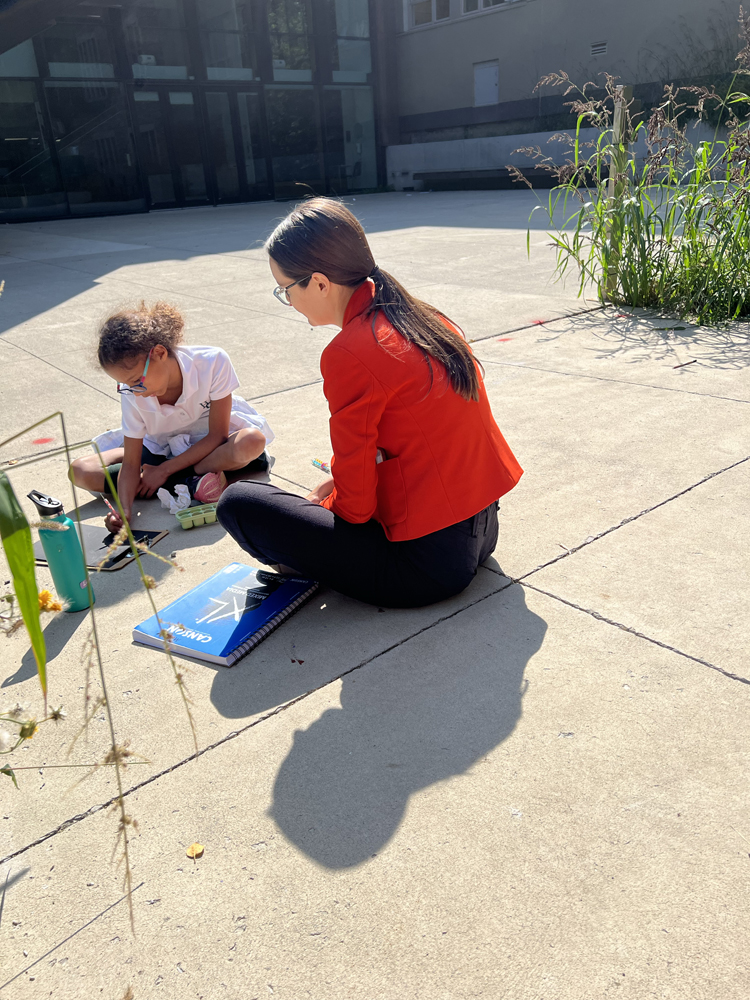 Indigenous educator Marissa Magneson works with a Grade 6 student.