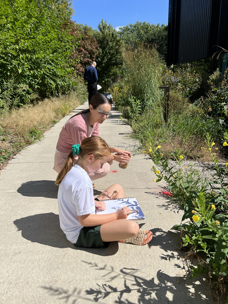 Indigenous educator Marissa Magneson working with a Grade 6 student.