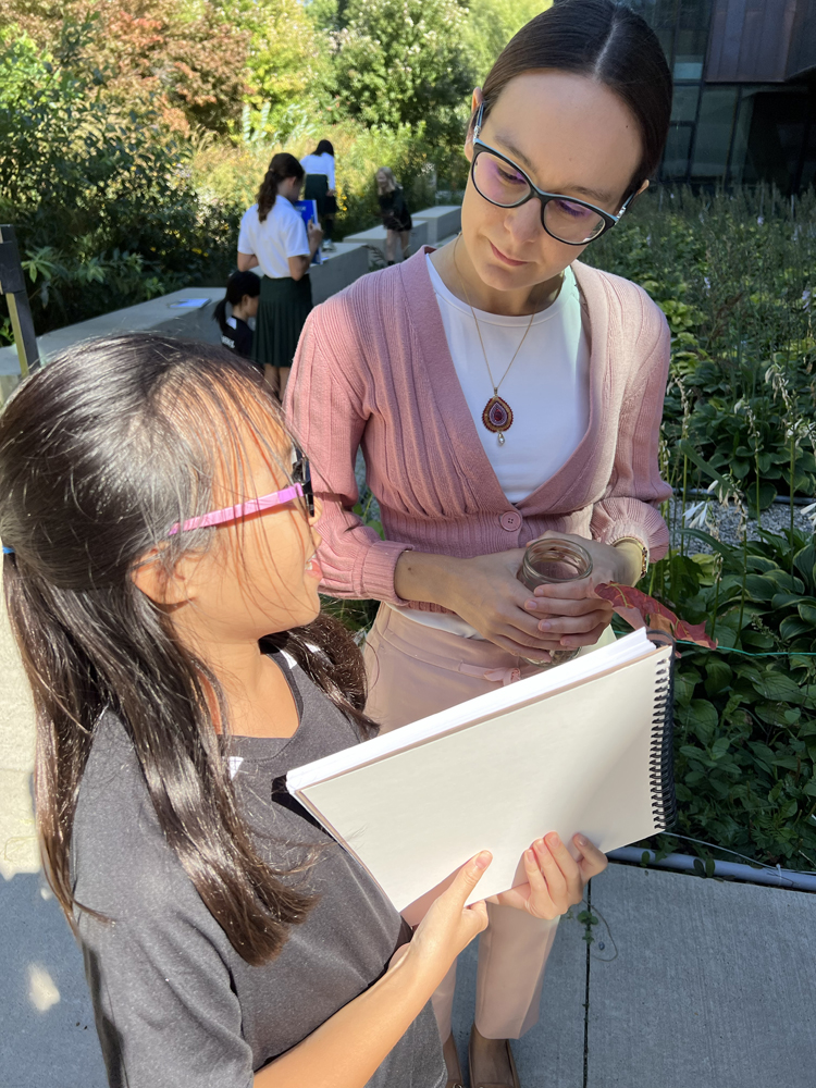 Indigenous educator Marissa Magneson works with a Grade 6 student.