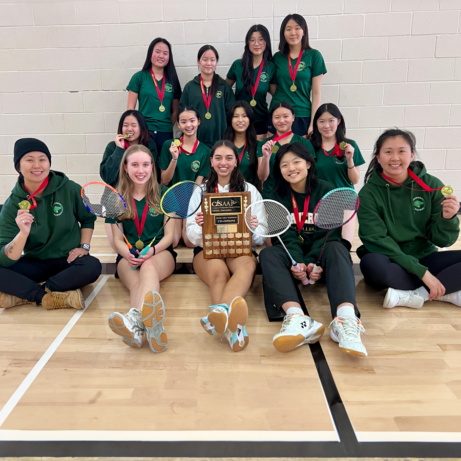 U20 Badminton Team with their trophy and awards.