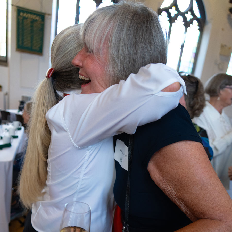 Two alumni hugging at Reunion Week.