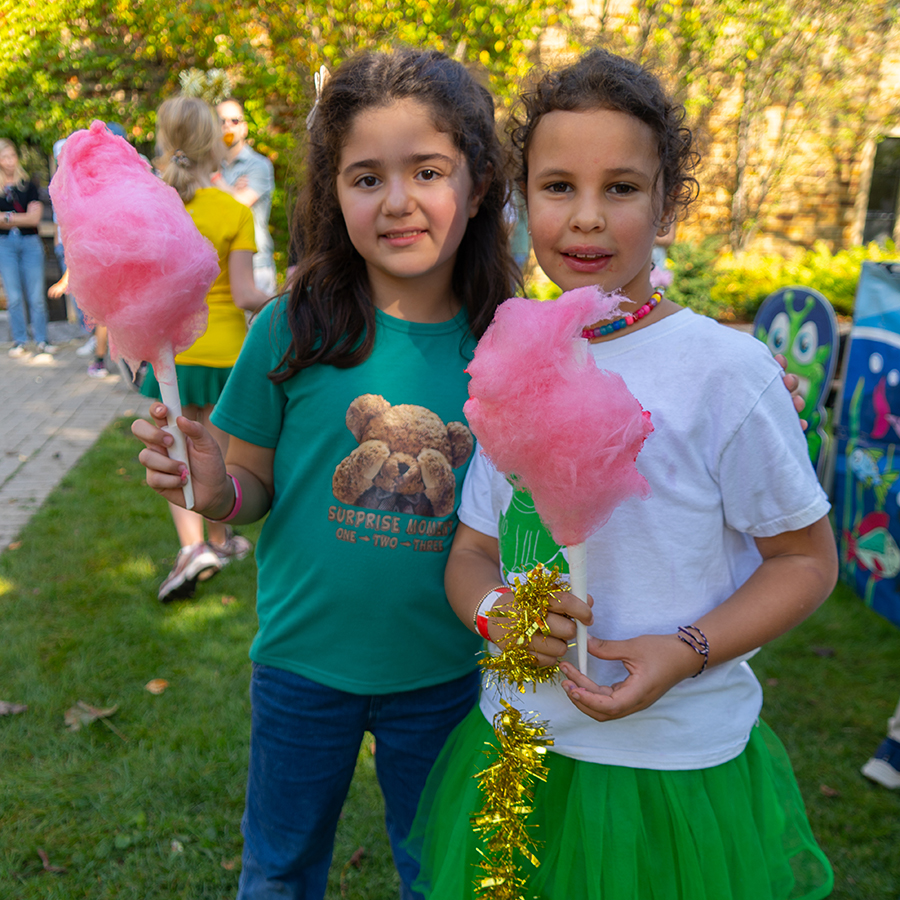 Students holding cotton candy at Celebration Day.
