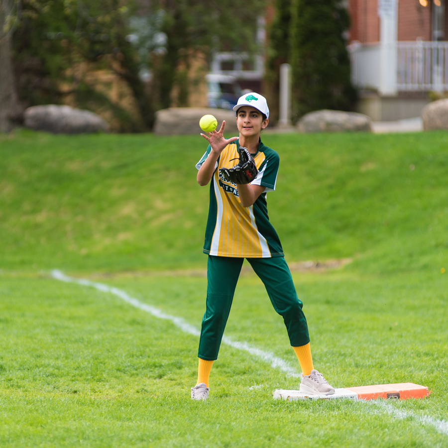 student playing softball
