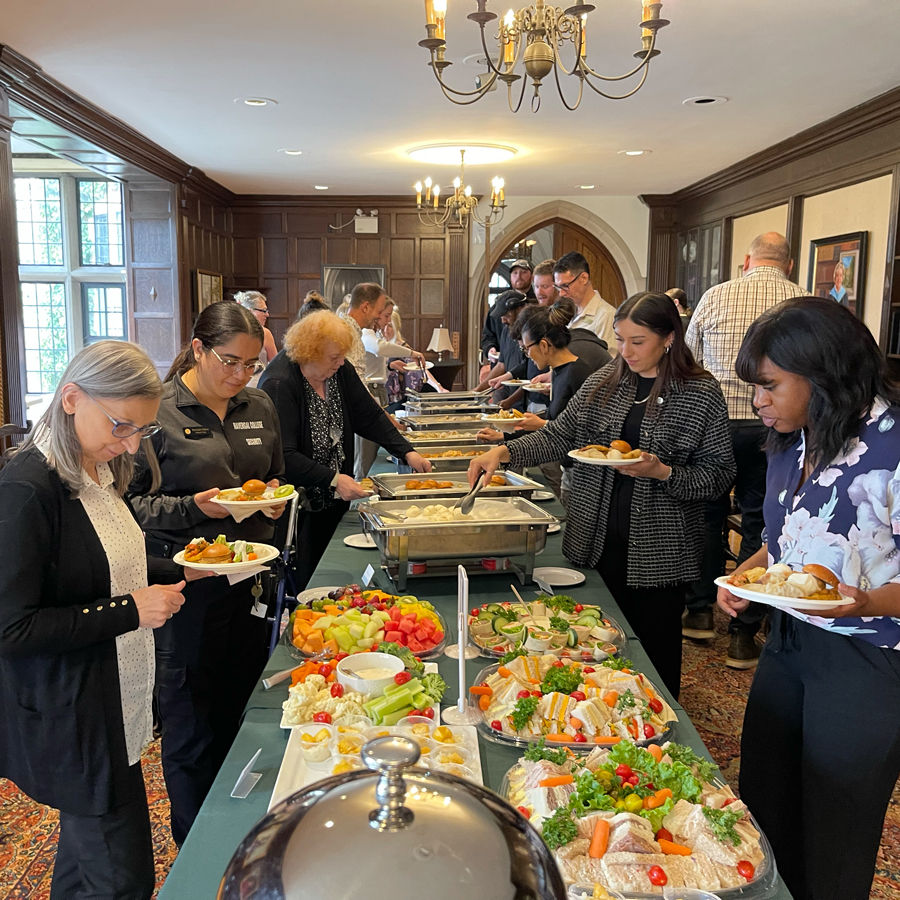 Faculty and staff at a buffet at last year's faculty and staff appreciation event.
