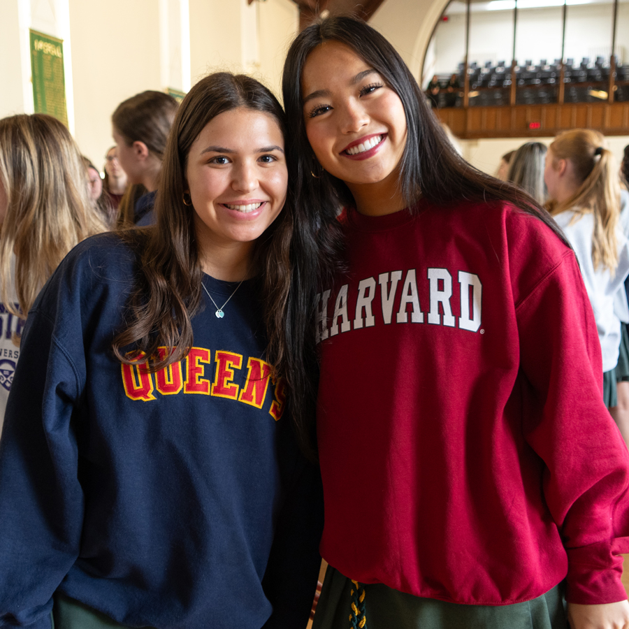 Grade 12 students wearing university sweatshirts.