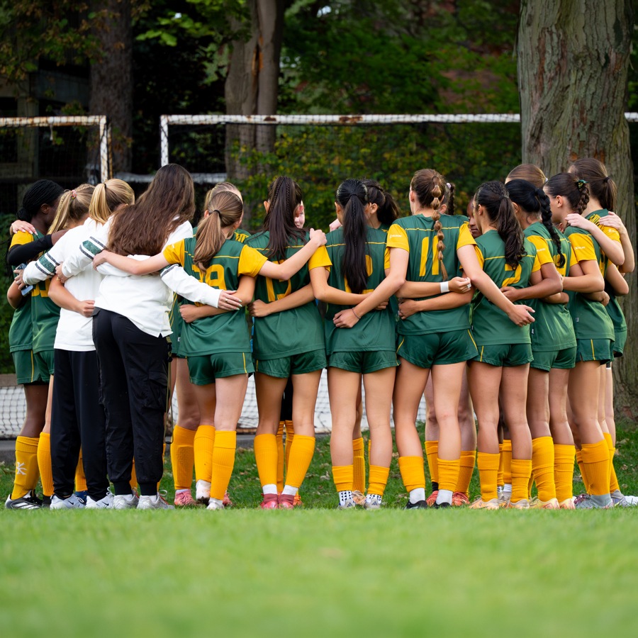 Havergal's U20 Soccer Team in a huddle before a game.